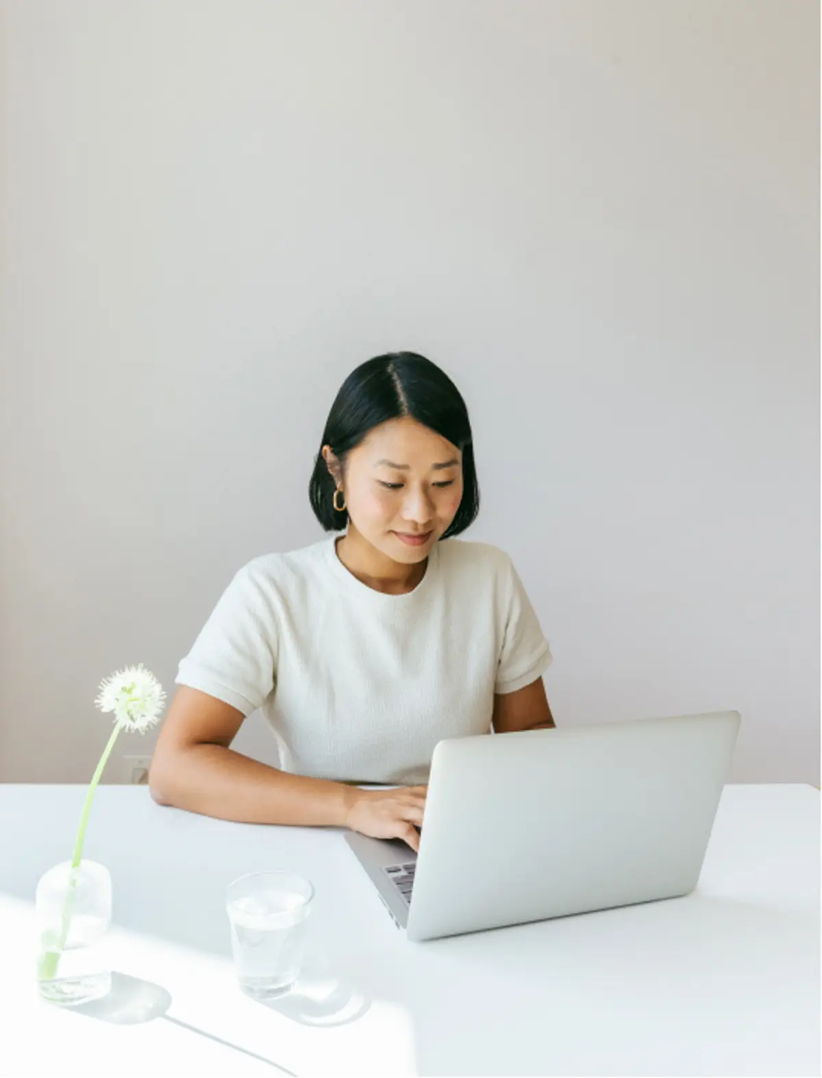 Startup employee typing on laptop. 
